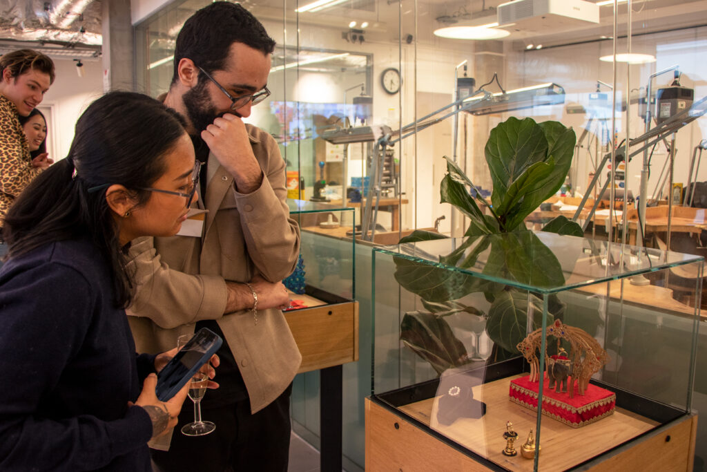 BAJ Students looking at engagement rings on display for Lewis Malka project