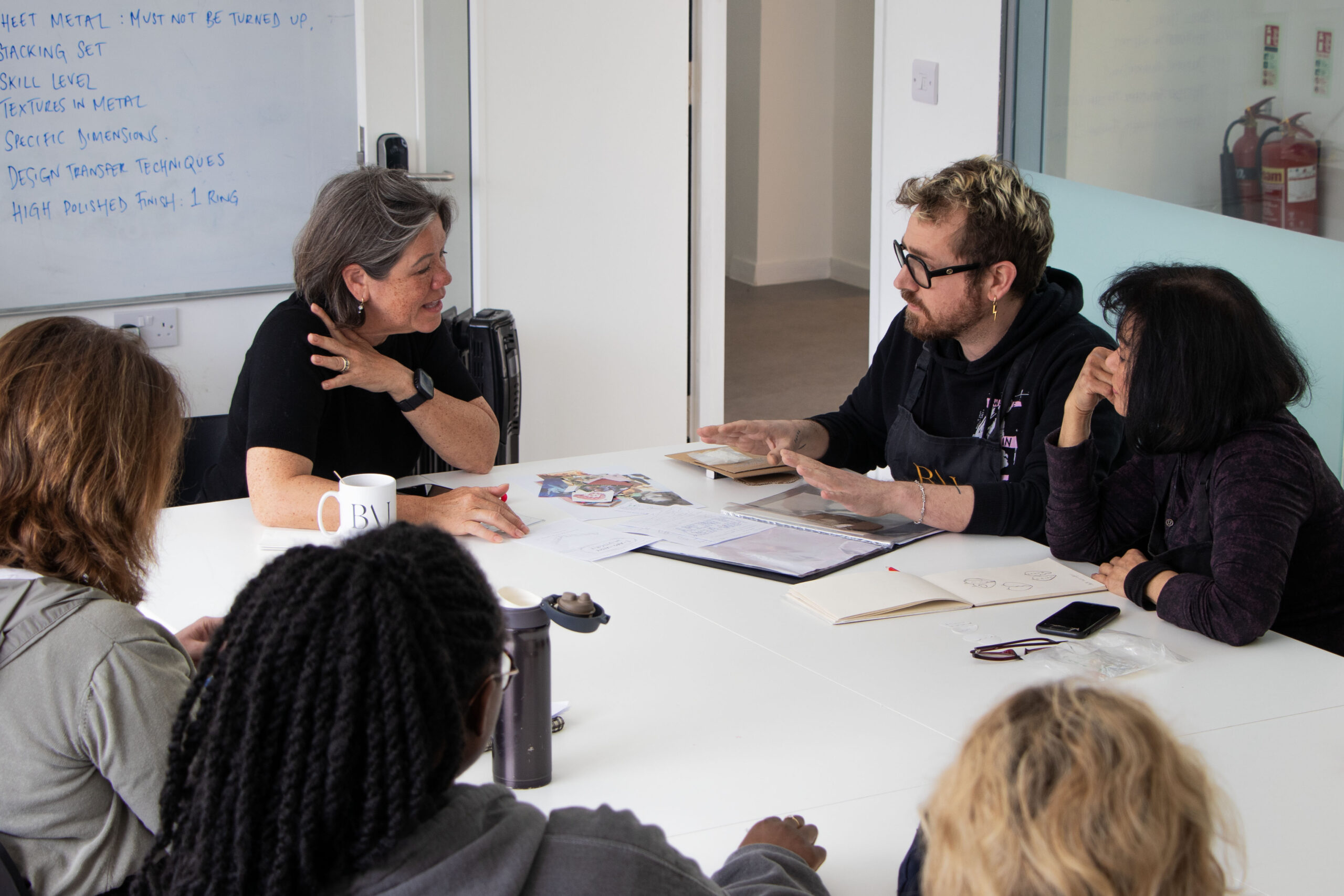 Jewellery Consultant Liz Olver with BAJ Jewellery design students providing guidance.